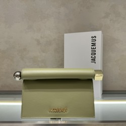 Pochette Rond ｜Sculpture Bag
This unique handbag is called "take-out clutch" made of lambskin with rolled-up folded cover and internal snap closure, rolled up like a take-out bag with metal handles and metal balls, silver-colored chain ⛓️ should