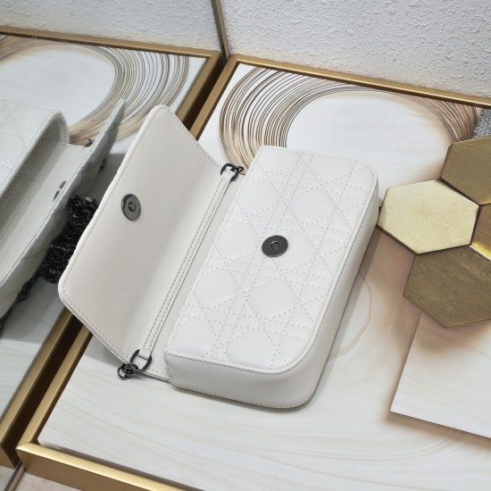 200 WITH BOX LADY DIOR MOBILE PHONE POUCH WHITE GUN CLOSURE This Lady Dior cell phone pouch is elegantly crafted in creamy white sheepskin leather with a rattan check pattern and a removable light gold-tone metal DIOR charm with a detachable chain adorned