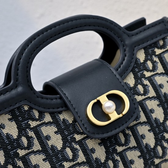 210 This Dior Jolie Top Handle Mini Chain Bag from the Early Spring 2016 Ready-to-Wear collection is an elegant and sophisticated design crafted in creamy white sheepskin leather with a rattan check flap embellished with a gold-tone metal CD logo and whit