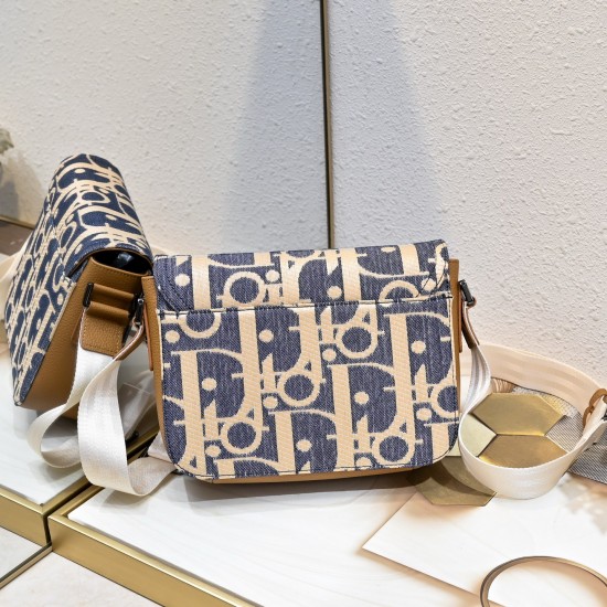 NEW SHIPPING 260 ORIGINAL BLUE FABRIC FEATURED TOP OF THE LINE WITH LEATHER ORIGINAL This mini saddle messenger bag is smart and stylish, crafted in black grained cowhide leather with a flap closure and the DIOR logo to emphasize the sophistication and ch