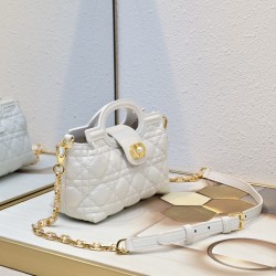 210 The Dior Jolie Top Handle Mini Chain Handbag is a new addition to the Early Spring 2016 Ready-to-Wear collection and features an elegant and sophisticated design crafted in creamy white sheepskin leather adorned with rattan latticework flap embellishe