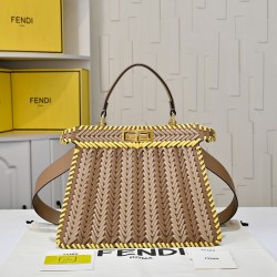 410 Model 33200 New! New in stock New in stock Iconic Peekaboo ISeeU large handbag Handmade leather weave with signature twist lock on both sidesSoft leather lining in the same color visible from the outsideTwo compartments separated by a rigid dividerFea