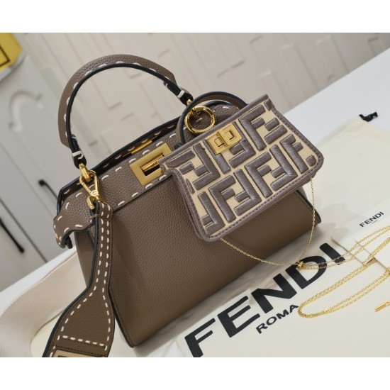 Model 3309320NEWFendi's iconic Peekaboo ISeeU medium handbag in full-grain leatherLarge, hand-stitched sides with classic twist locksFrom the outside, you can see the full-grain leather lining in the same colorTwo compartments separated by a rigid divider