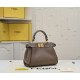 Model 3309320NEWFendi's iconic Peekaboo ISeeU medium handbag in full-grain leatherLarge, hand-stitched sides with classic twist locksFrom the outside, you can see the full-grain leather lining in the same colorTwo compartments separated by a rigid divider