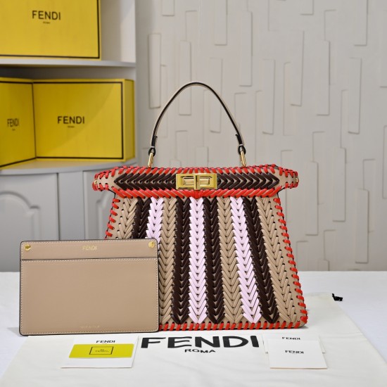 410 Model 33200 New! New in stock New in stock Iconic Peekaboo ISeeU large handbag Handmade leather weave with signature twist lock on both sidesSoft leather lining in the same color visible from the outsideTwo compartments separated by a rigid dividerFea