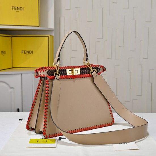 410 Model 33200 New! New in stock New in stock Iconic Peekaboo ISeeU large handbag Handmade leather weave with signature twist lock on both sidesSoft leather lining in the same color visible from the outsideTwo compartments separated by a rigid dividerFea