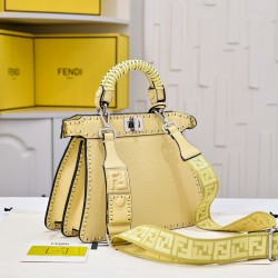 350 model 7705 the iconic peekaboo iseeu ideal compact handbag is hand-stitched with 306 stitches in the same color and large bright threads representing traditional selleria craftsmanship in a selection of dove grey cuoio romano leather with iconic natur