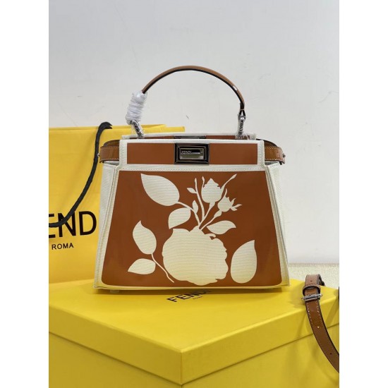 Upgraded Cowhide 390 with BoxFendi's new iconic Peekaboo pouch in black canvas and patent leather is engraved with a rose motif displaying a natural canvas backgroundThe sides are decorated with a signature twist lockTwo compartments are lined with canvas