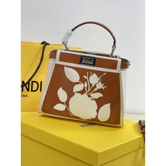 Upgraded Cowhide 390 with BoxFendi's new iconic Peekaboo pouch in black canvas and patent leather is engraved with a rose motif displaying a natural canvas backgroundThe sides are decorated with a signature twist lockTwo compartments are lined with canvas
