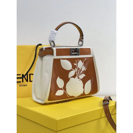 Upgraded Cowhide 390 with BoxFendi's new iconic Peekaboo pouch in black canvas and patent leather is engraved with a rose motif displaying a natural canvas backgroundThe sides are decorated with a signature twist lockTwo compartments are lined with canvas