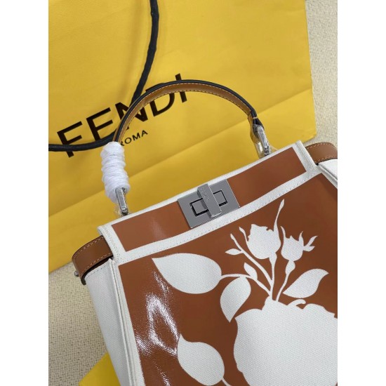 Upgraded Cowhide 390 with BoxFendi's new iconic Peekaboo pouch in black canvas and patent leather is engraved with a rose motif displaying a natural canvas backgroundThe sides are decorated with a signature twist lockTwo compartments are lined with canvas