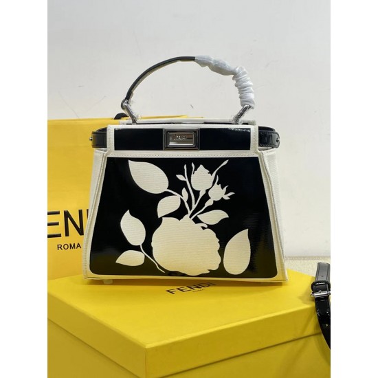 Upgraded Cowhide Lot 390 with Box Fendi's new iconic Peekaboo pouch in black canvas and patent leather is engraved with a rose motif displaying a natural canvas backing and is adorned with a signature twist lock on both sides.Canvas liningTwo compartments