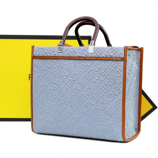 Lot 330FEND1 Sunshine medium tote bag in denim with FENDI Mirror pattern all over brown rigid leather handles decorated with FENDI ROMA features spacious lined interior compartments leather silhouette and gold finish metal pieces with two carry handles an