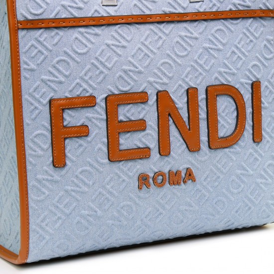 Lot 330FEND1 Sunshine medium tote bag in denim with FENDI Mirror pattern all over brown rigid leather handles decorated with FENDI ROMA features spacious lined interior compartments leather silhouette and gold finish metal pieces with two carry handles an