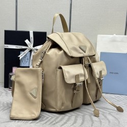 F480 with a full set of the right version of the counter packaging exclusive customized classic large backpack 1BZ811 milk tea color this nylon shoulder bag with exquisite Saffiano leather trim fusion of materials and decorated with triangular logo highli