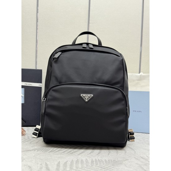 F500 classic pop-up duffel bag 2VZ104 triangular standard goods nylon material adjustable straps back fabric Saffiano leather carry handle zipper closure two zipper outer pockets nylon lining one zipper inner pocket and one pocket sewn to the interior wal