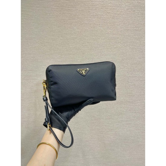 P220 New Clutch 1NS693 Gold Hardware This clutch is made of imported nylon fabric with a white lacquered triangular logo decorating the simple lines Open the bag to reveal a zippered interior pocket Removable leather wristlet for both men and women Lightw