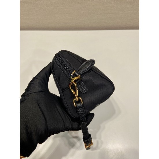 P220 New Clutch 1NS693 Gold Hardware This clutch is made of imported nylon fabric with a white lacquered triangular logo decorating the simple lines Open the bag to reveal a zippered interior pocket Removable leather wristlet for both men and women Lightw