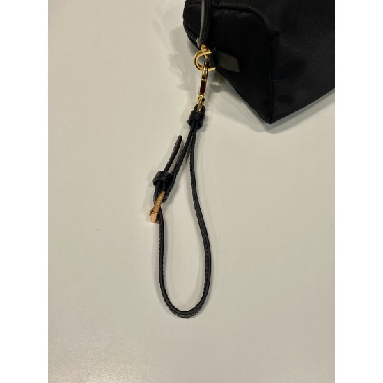 P220 New Clutch 1NS693 Gold Hardware This clutch is made of imported nylon fabric with a white lacquered triangular logo decorating the simple lines Open the bag to reveal a zippered interior pocket Removable leather wristlet for both men and women Lightw