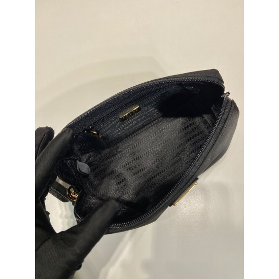 P220 New Clutch 1NS693 Gold Hardware This clutch is made of imported nylon fabric with a white lacquered triangular logo decorating the simple lines Open the bag to reveal a zippered interior pocket Removable leather wristlet for both men and women Lightw