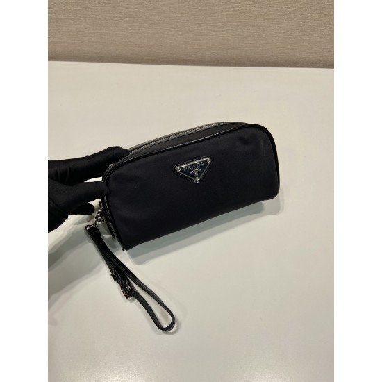 P230 new handbag 2NE063 co-ed models This practical and exquisite pouch is made of innovative recycled nylon fabric ReNylon with glossy leather details decorated with enameled triangular metal logo highlighting the brand's classic features Removable leath