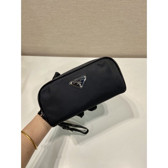P230 new handbag 2NE063 co-ed models This practical and exquisite pouch is made of innovative recycled nylon fabric ReNylon with glossy leather details decorated with enameled triangular metal logo highlighting the brand's classic features Removable leath
