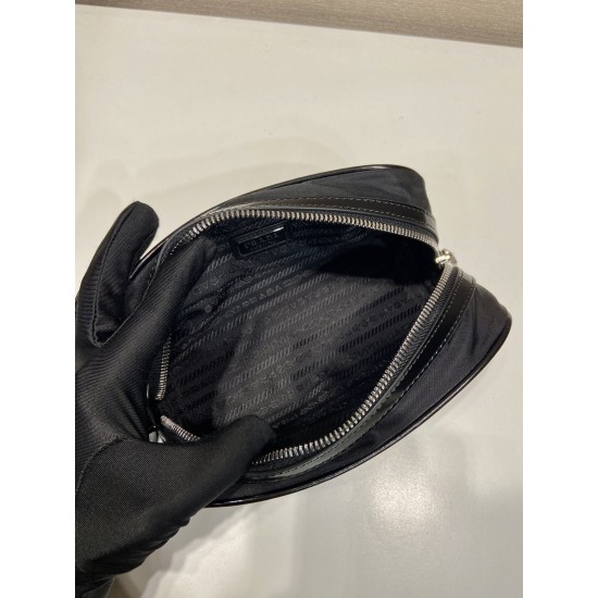 P230 new handbag 2NE063 co-ed models This practical and exquisite pouch is made of innovative recycled nylon fabric ReNylon with glossy leather details decorated with enameled triangular metal logo highlighting the brand's classic features Removable leath